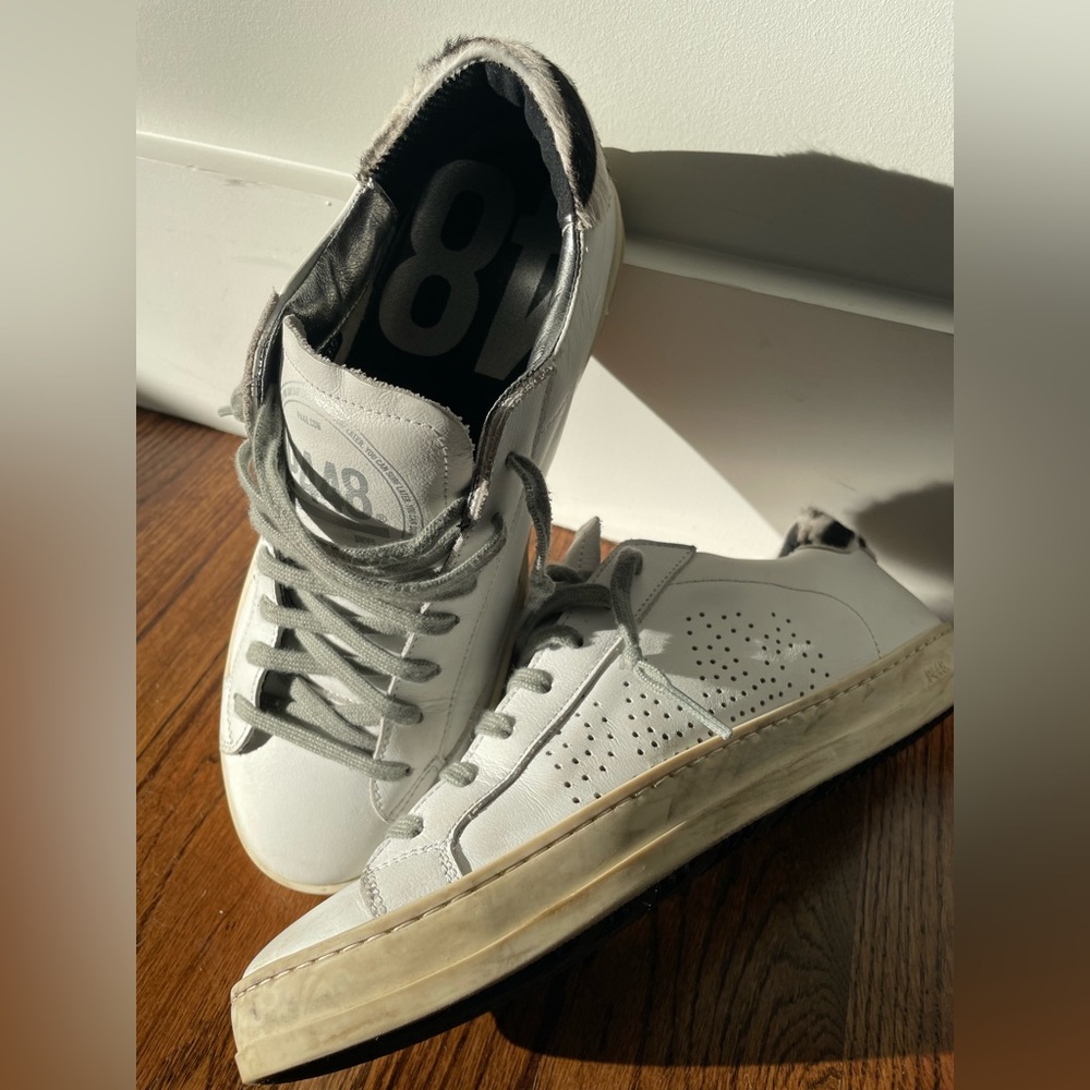 P448 John low-top with black and white leopard print.